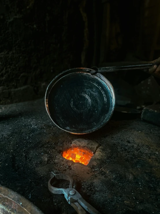 an open frying pan with some bright food in it