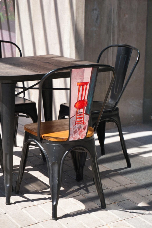 some chairs a table and lights on the ground