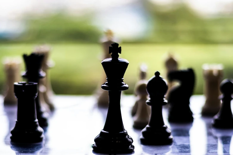 a large chess board with the pieces placed