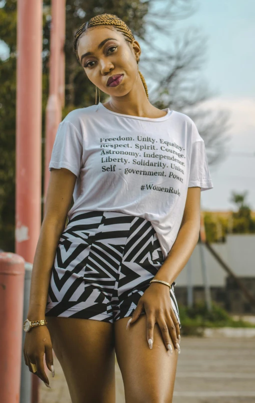 a woman in ze print shorts poses for the camera