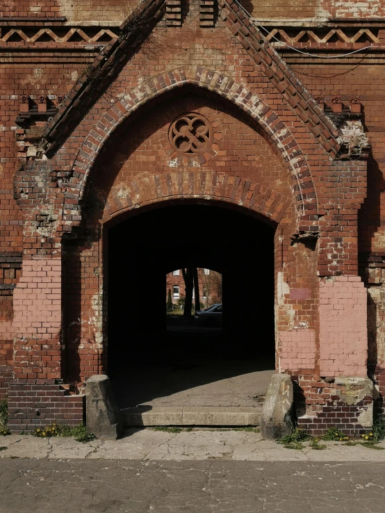 a doorway with a fire hydrant and benches in the center