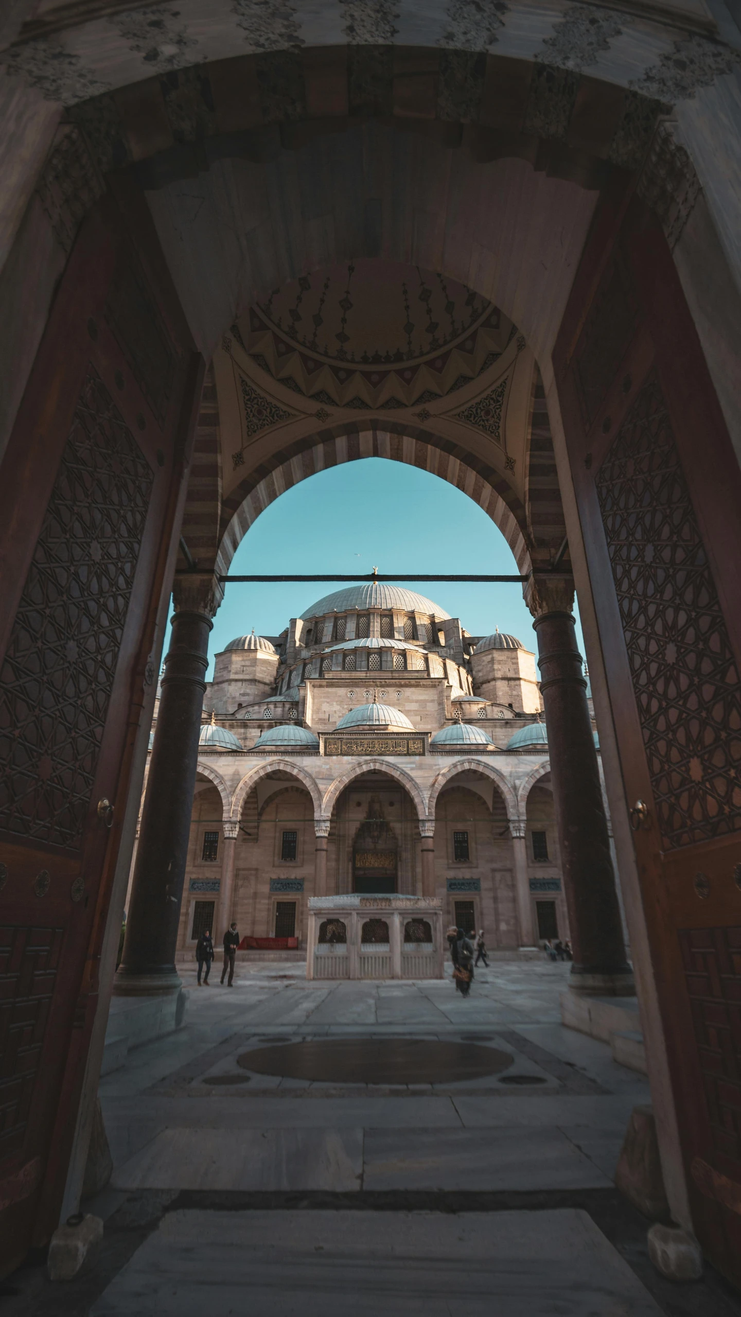 the arch leading up to an ancient courtyard