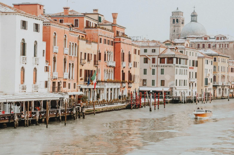 a body of water next to a row of buildings