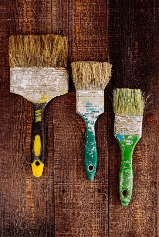 three brushes have been used as wall hangings