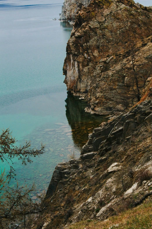 a lake and a boat are seen in the distance