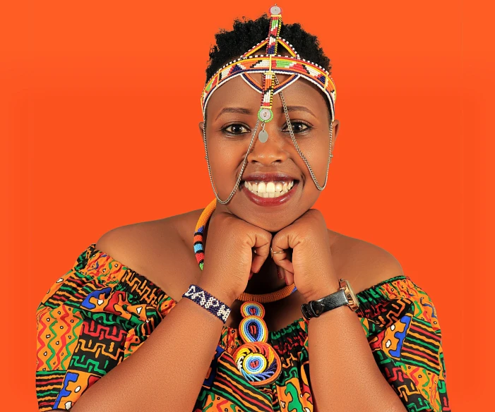 a woman poses for a portrait with her hands on her chin