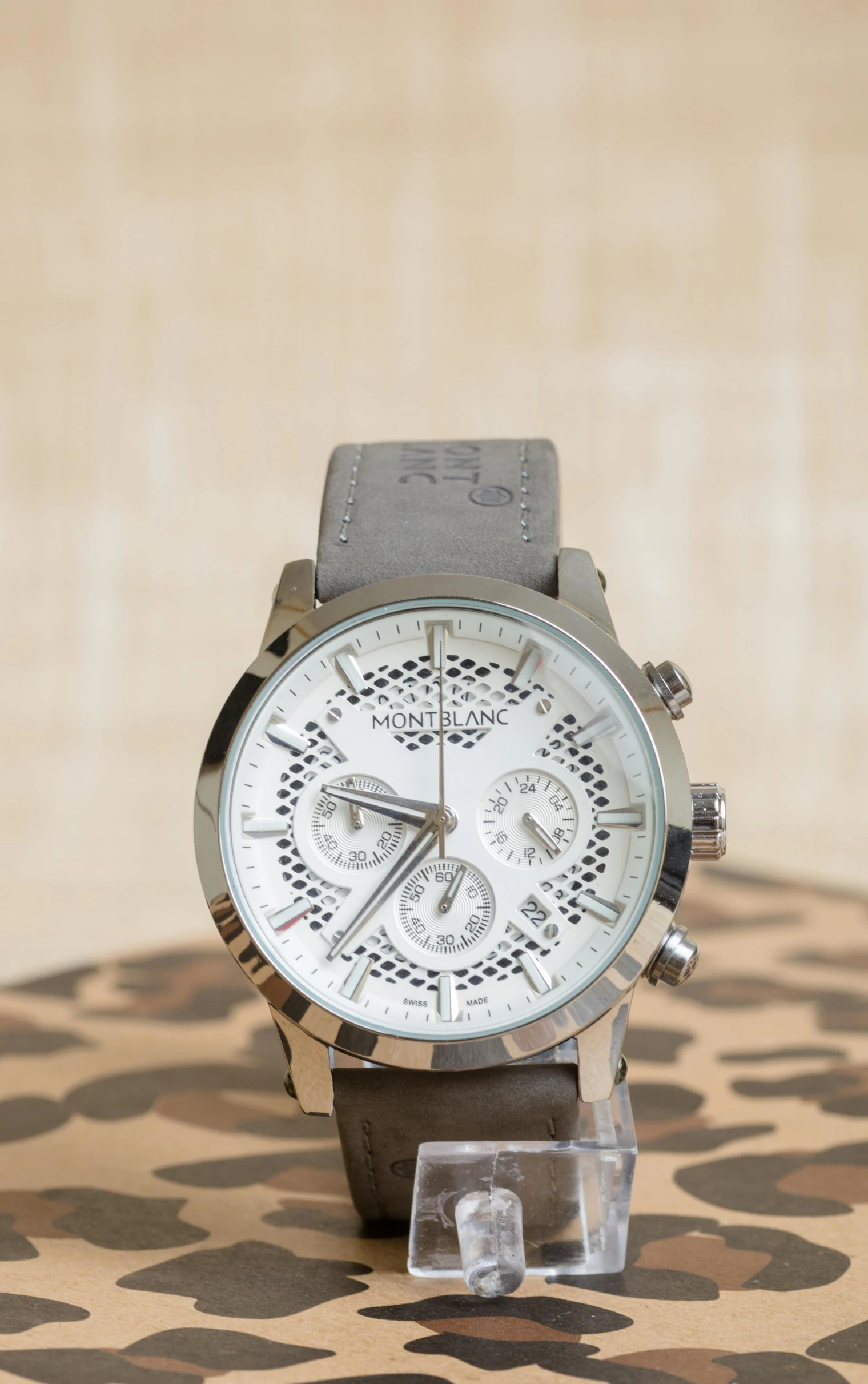 an attractive watch sits atop an animal print surface