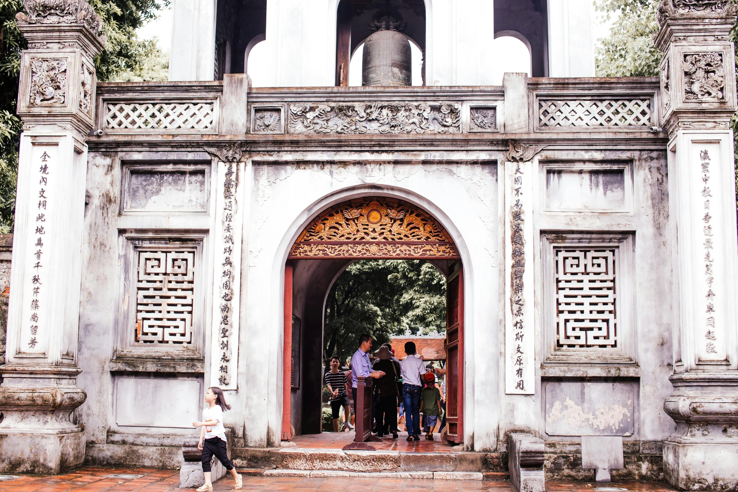 an open door into a building in a courtyard