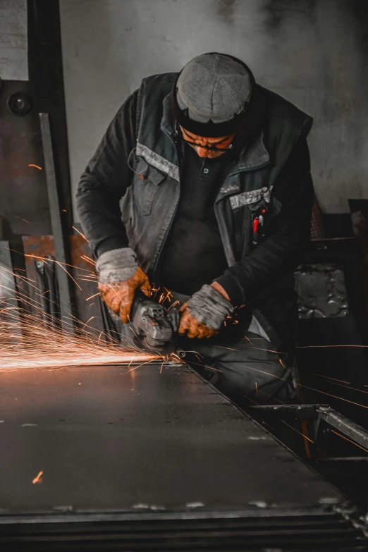 a man working on a piece of metal