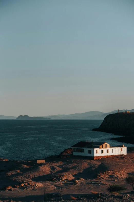 a house with the ocean in the background