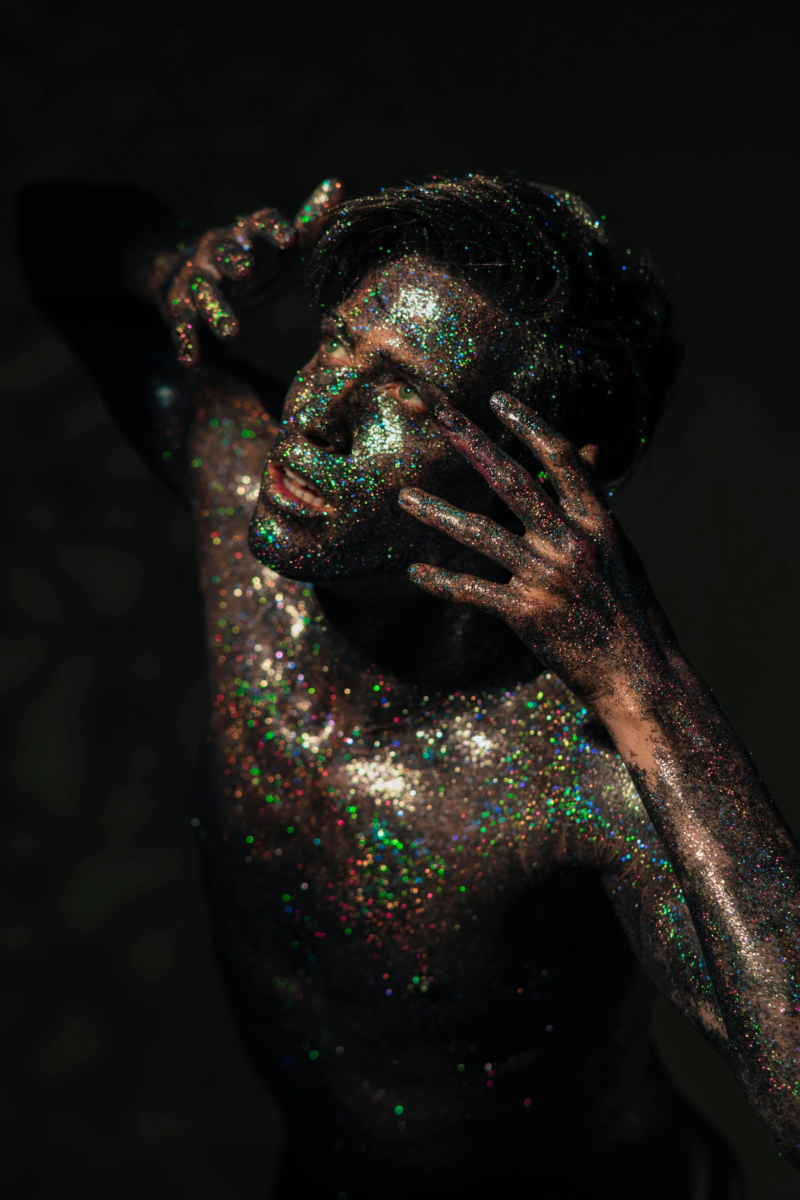 a woman covered in holographics is covered by powder