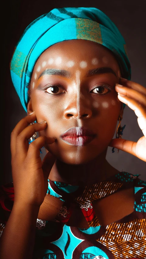 an african american woman holding a cellphone to her ear