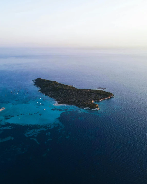 a small island with two large boats on top