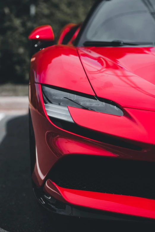 the front end of a red sports car