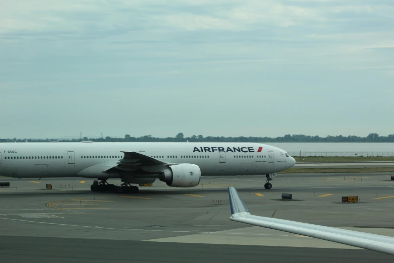 an airplane parked at the airport ready to load