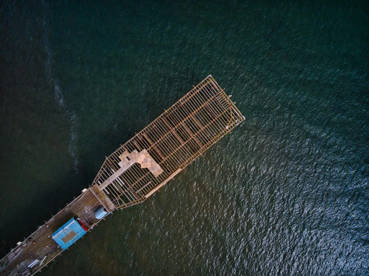 an aerial view of a large metal structure in the ocean