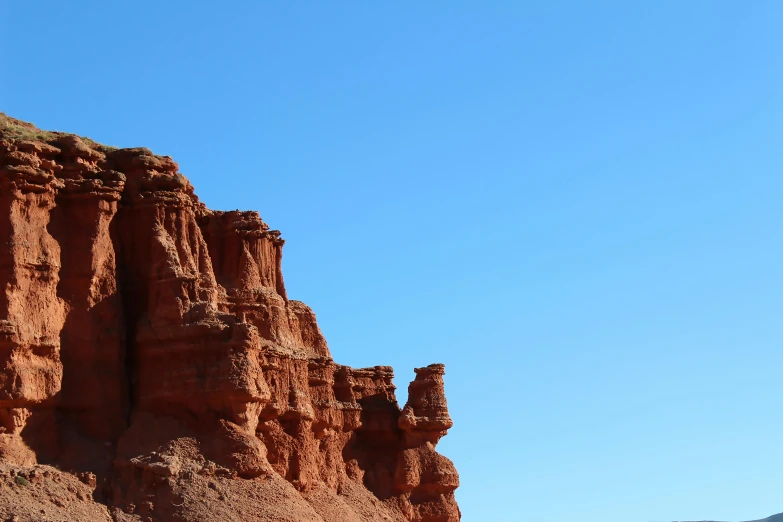 the view of a hill and canyon near desert