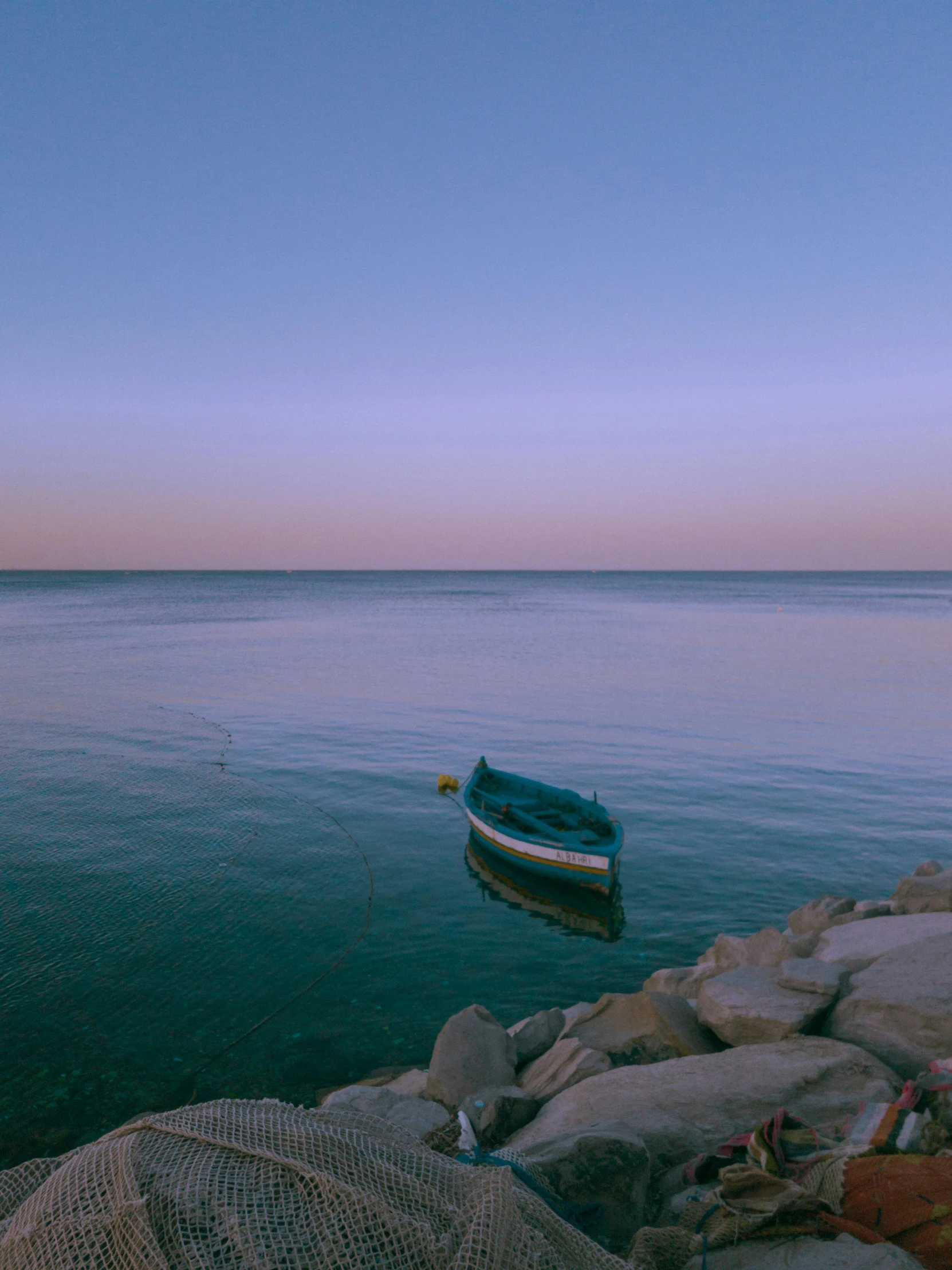 a boat floating on top of a body of water