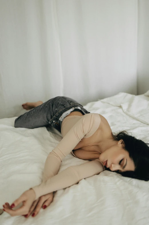 woman posing in a  lingerie on a bed