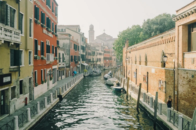 a river is running through a small city