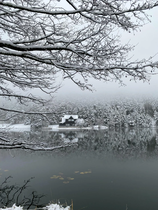 the water of this lake is frozen and covered in snow