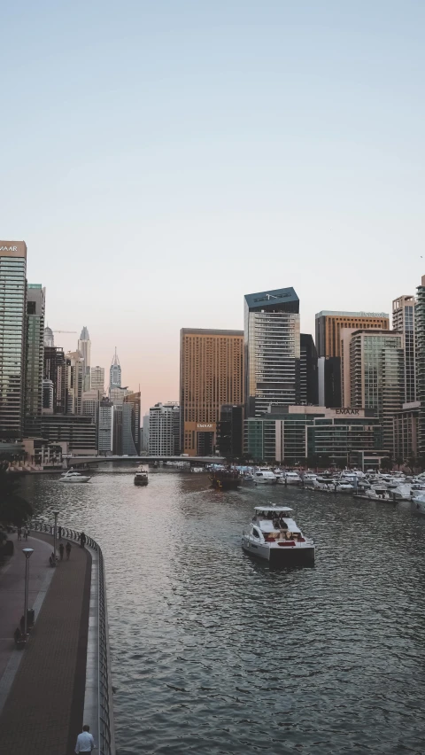 boats in a body of water near buildings