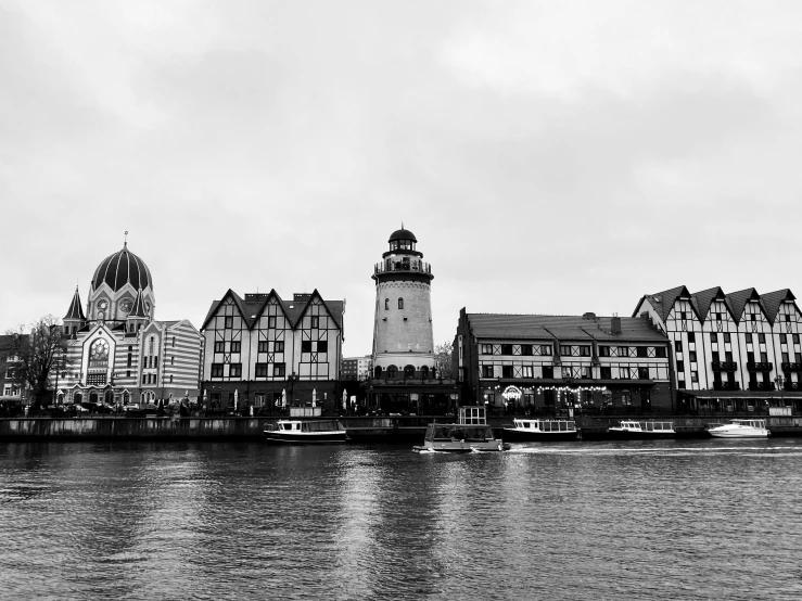 a town along the water in black and white