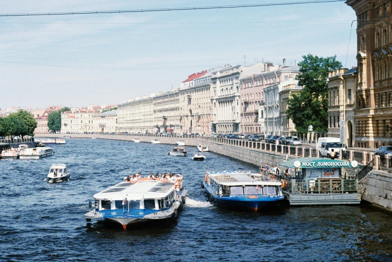 some boats in the water near buildings