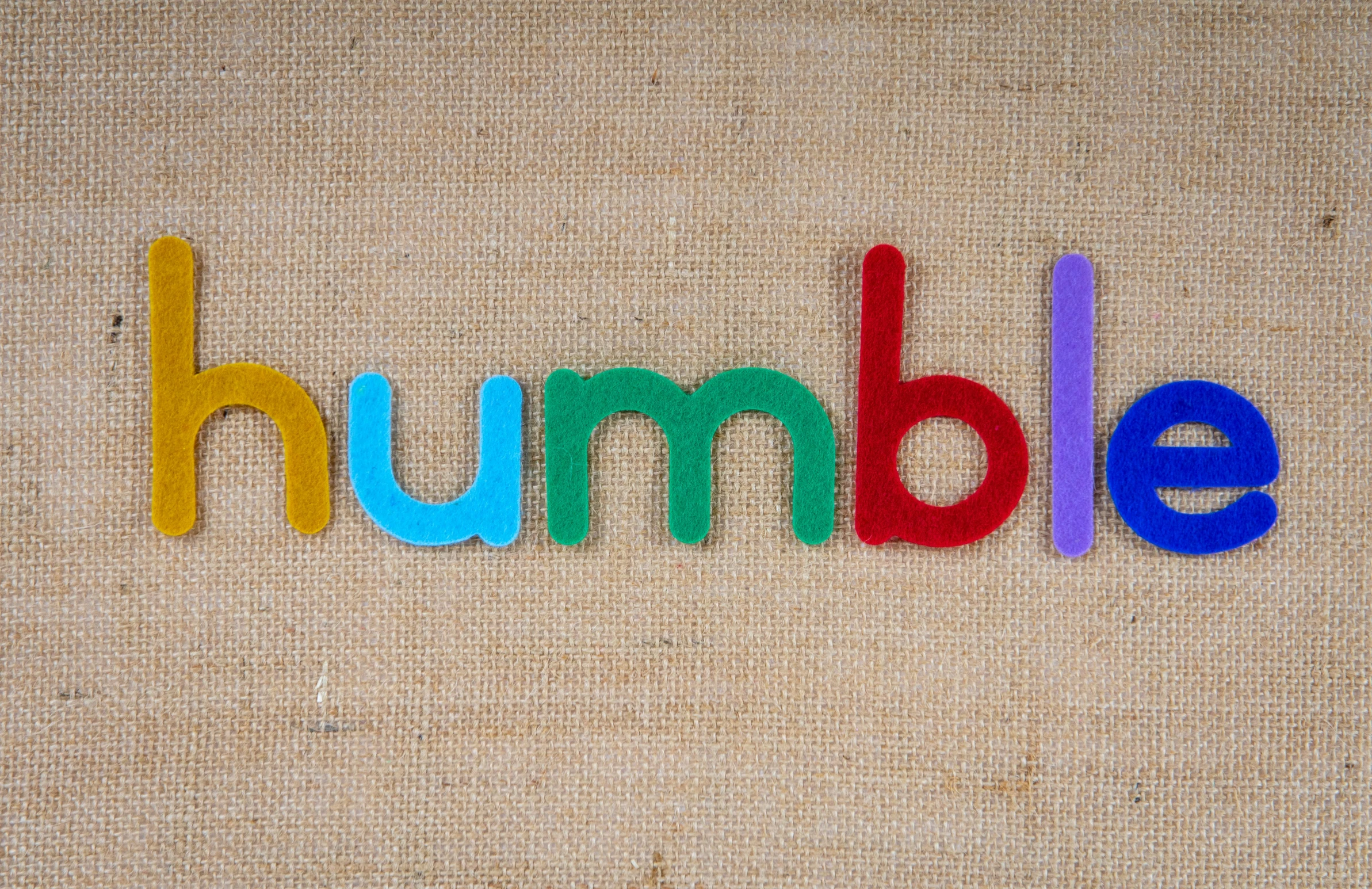the word humble spelled with colored wooden letters