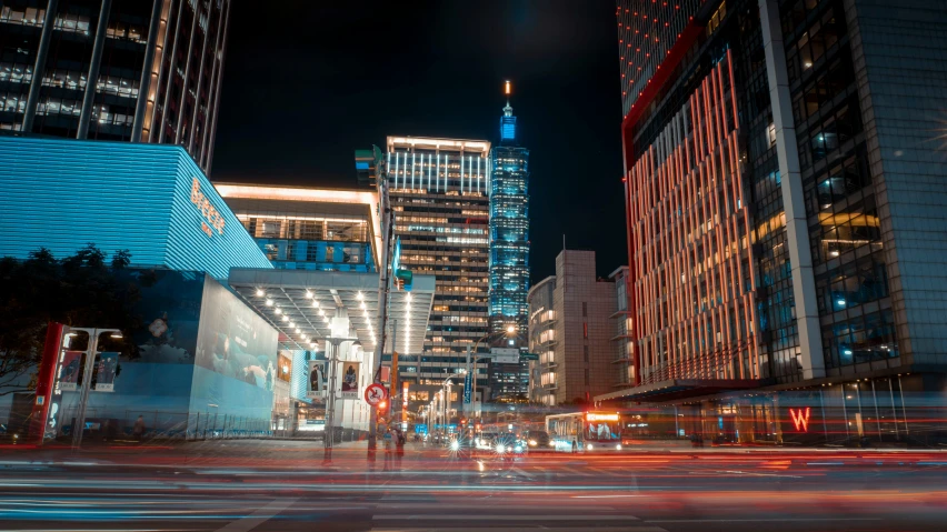 the people are crossing the street at night in the city