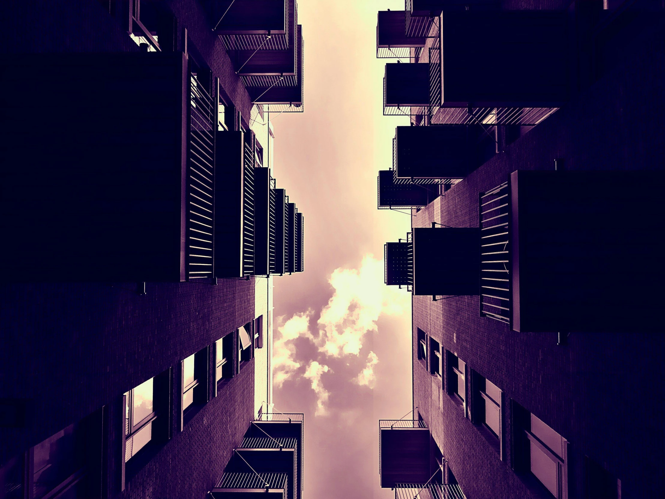 a picture of a city street filled with tall buildings