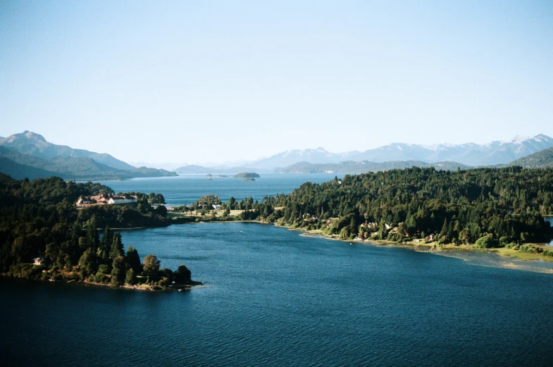 water surrounded by lots of mountains and trees