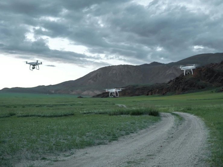 an image of two flying vehicles that are on land