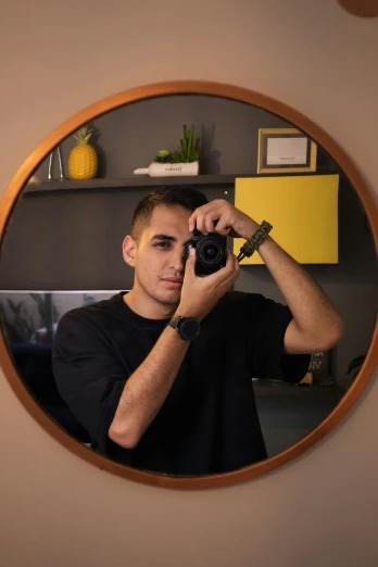 a man taking a picture in the mirror