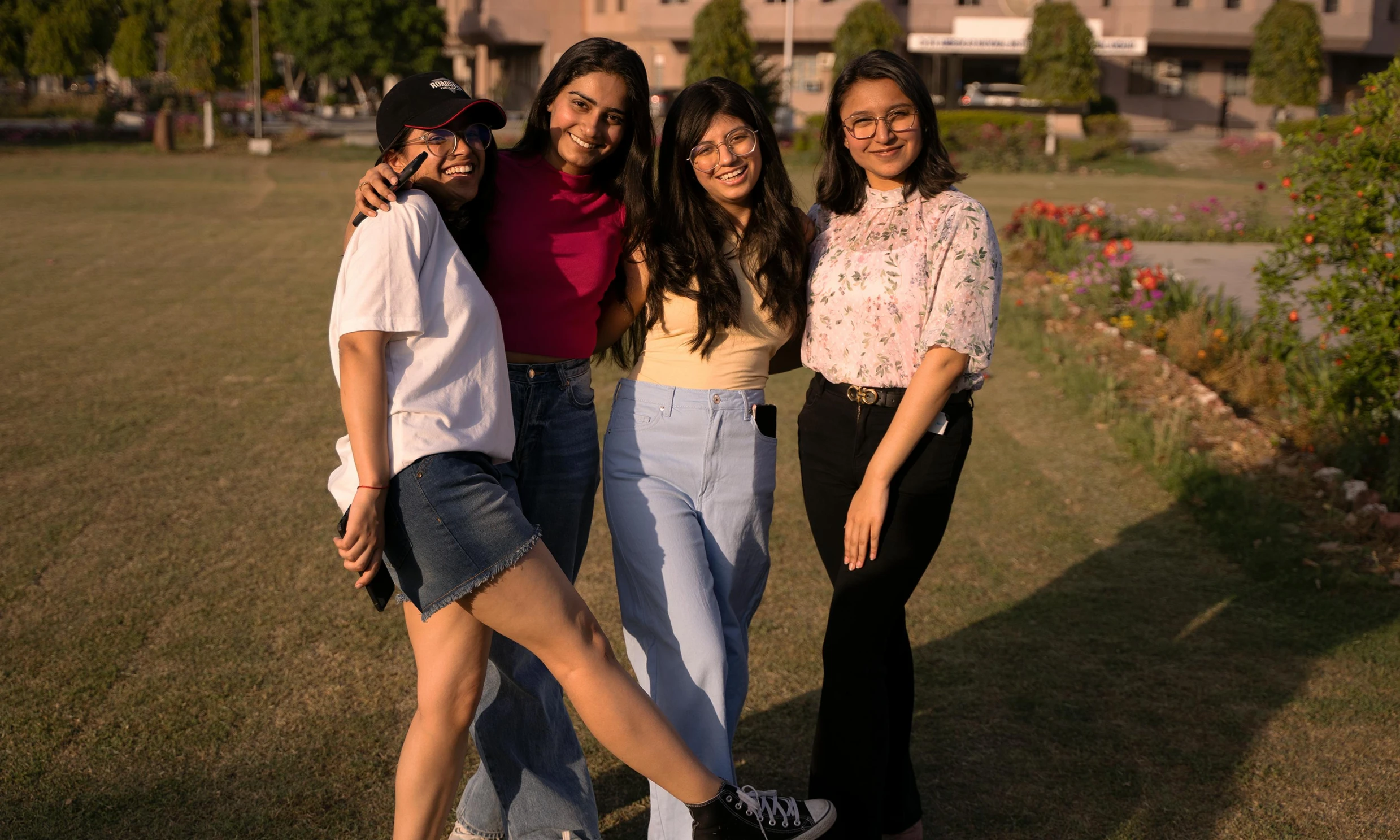 the girls are smiling and posing for a picture