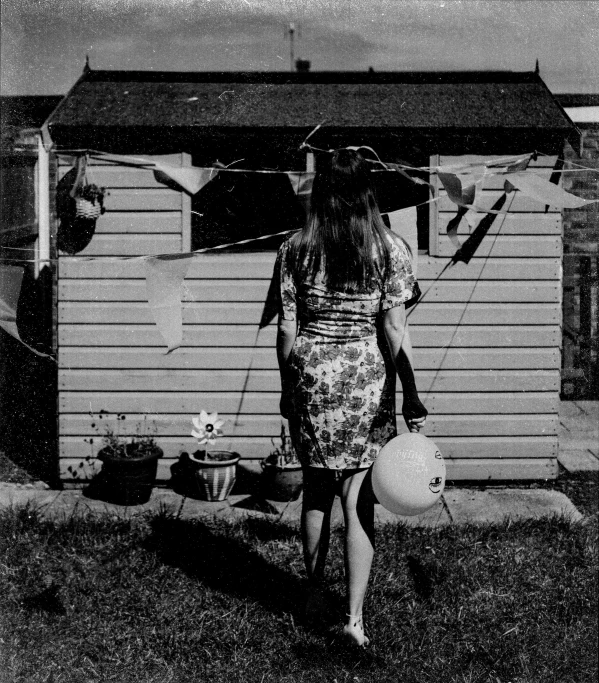 woman holding a fire hydrant and holding an umbrella