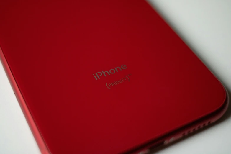 an image of a red tablet and iphone