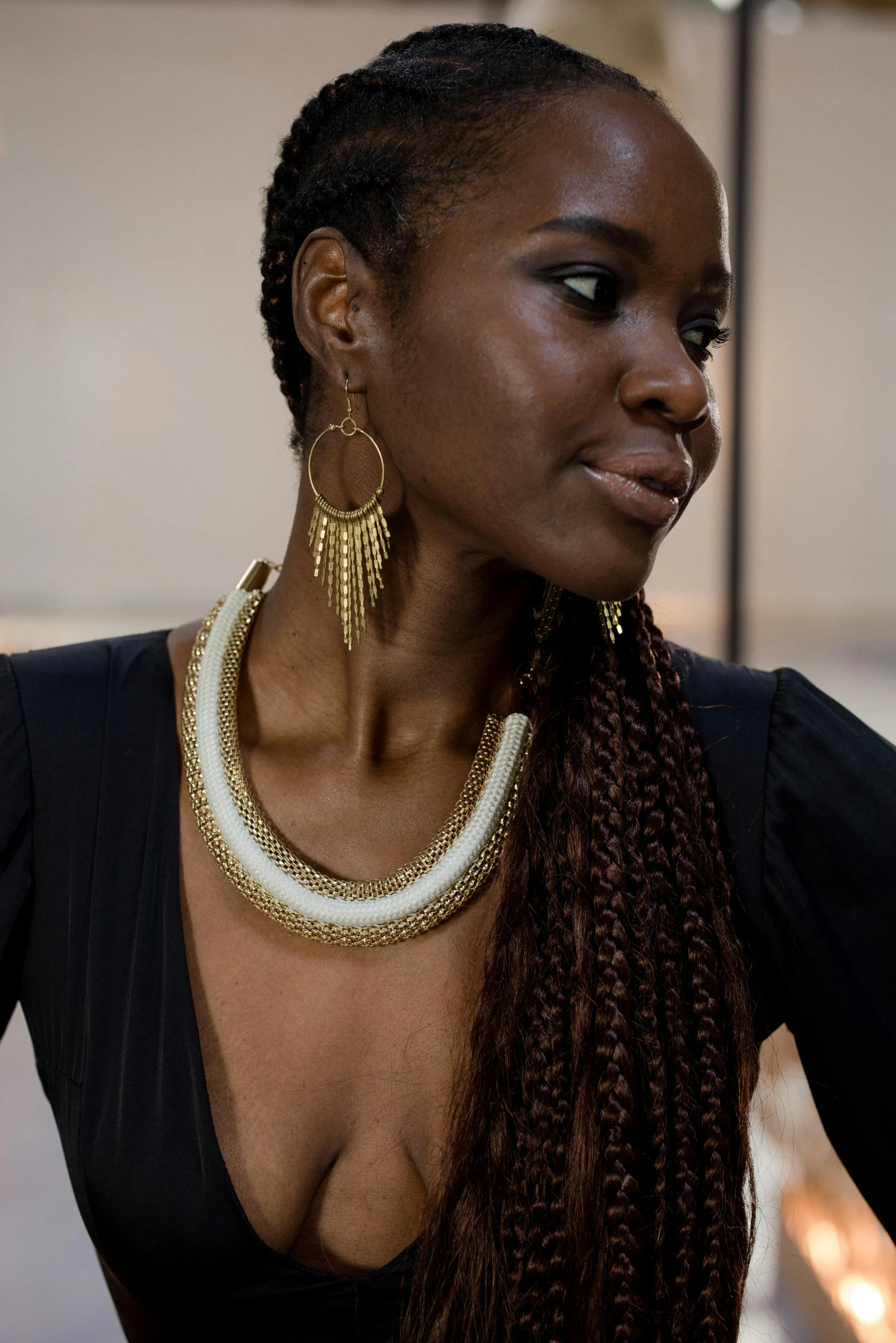 a woman in her ids and some very pretty necklaces