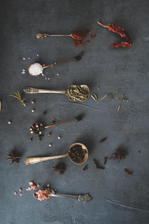 a variety of spoons that have various types of items in them