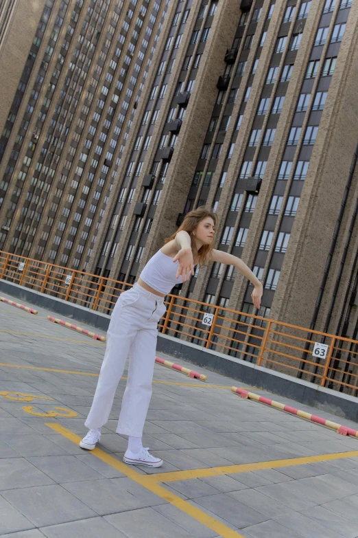 a person in white is doing tricks on a skateboard