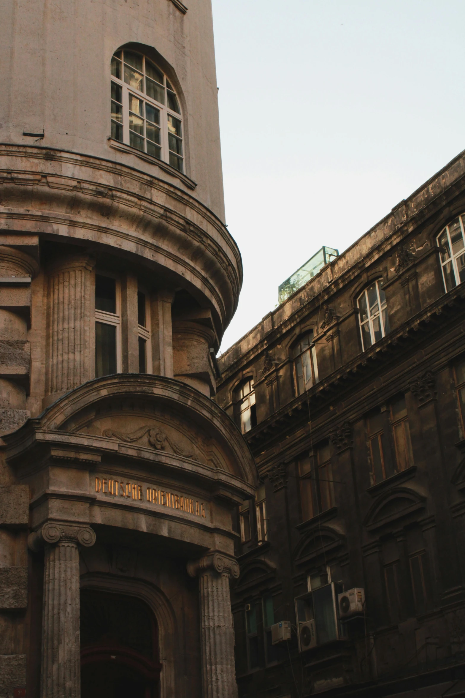 a tall building with many windows and a sign on it