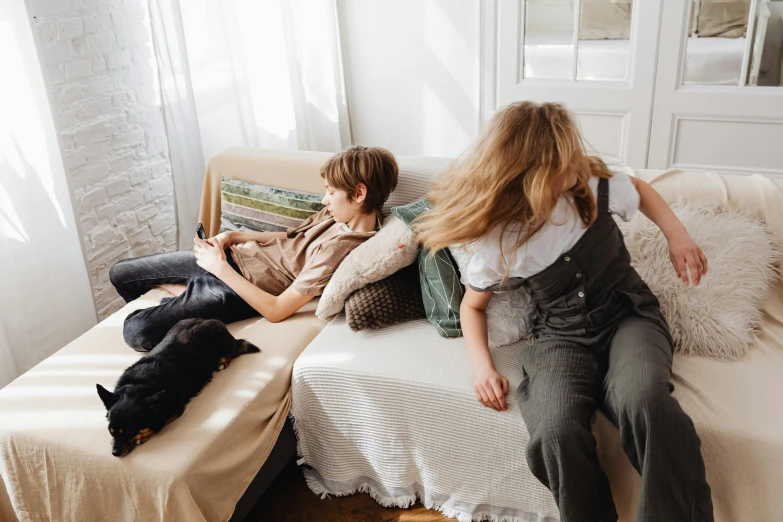 a lady and her dog sitting on a sofa