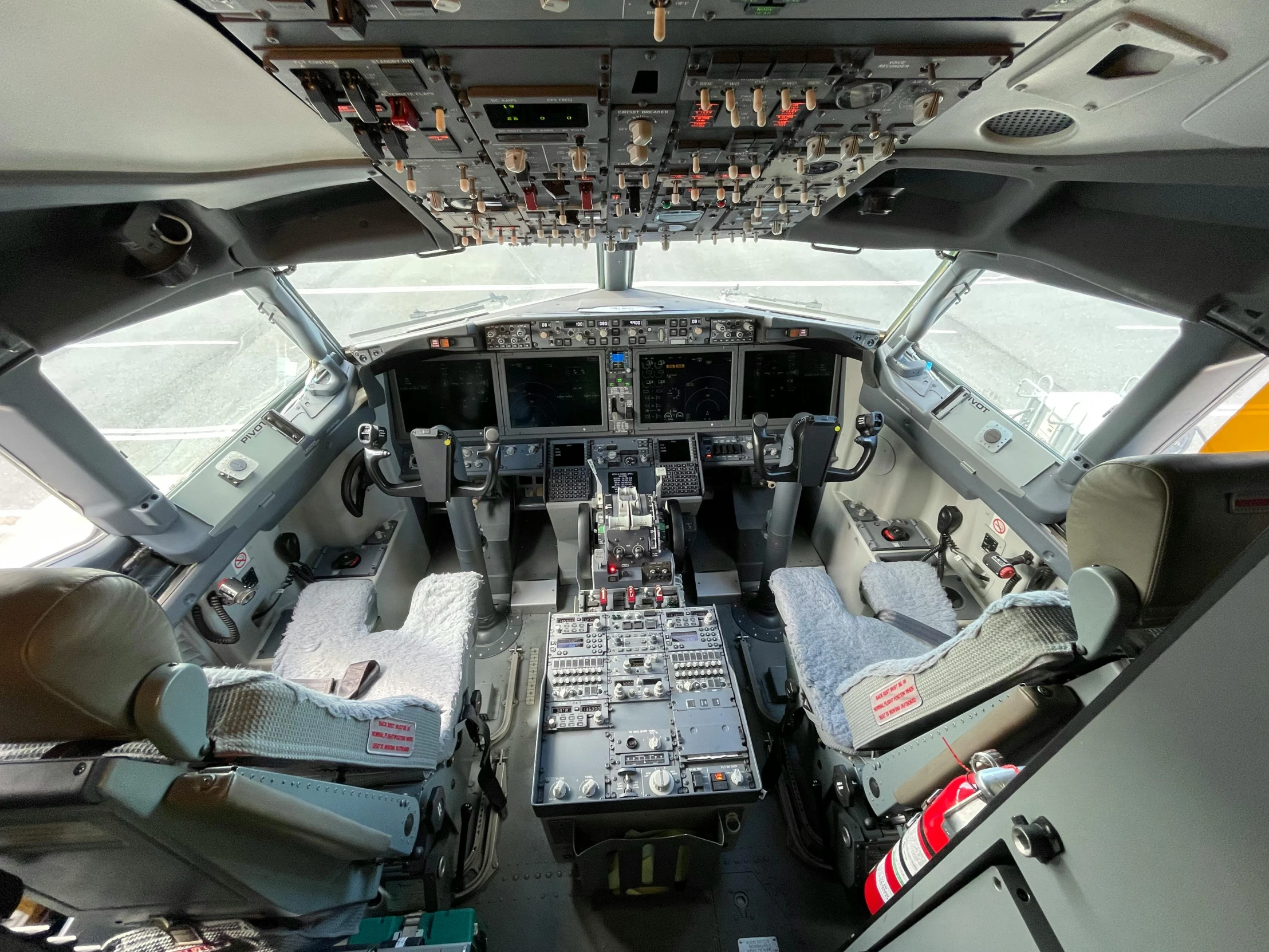 the cockpit of an airplane in which there is several small mattresses