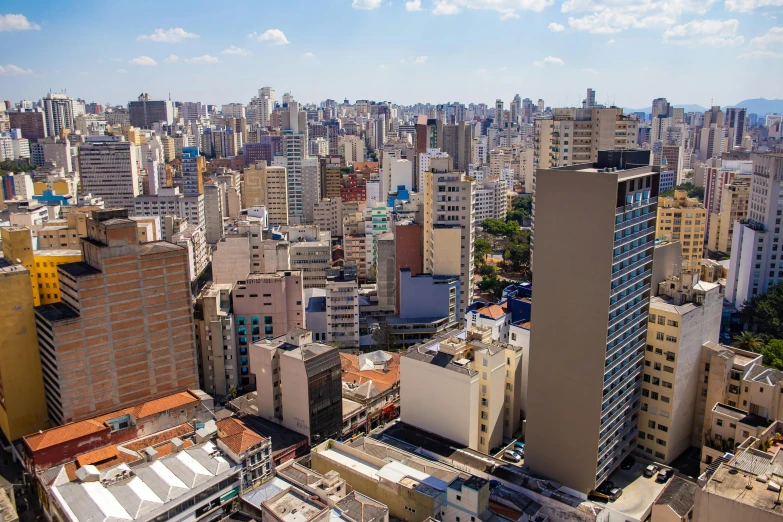 a city with many tall buildings and tall clouds