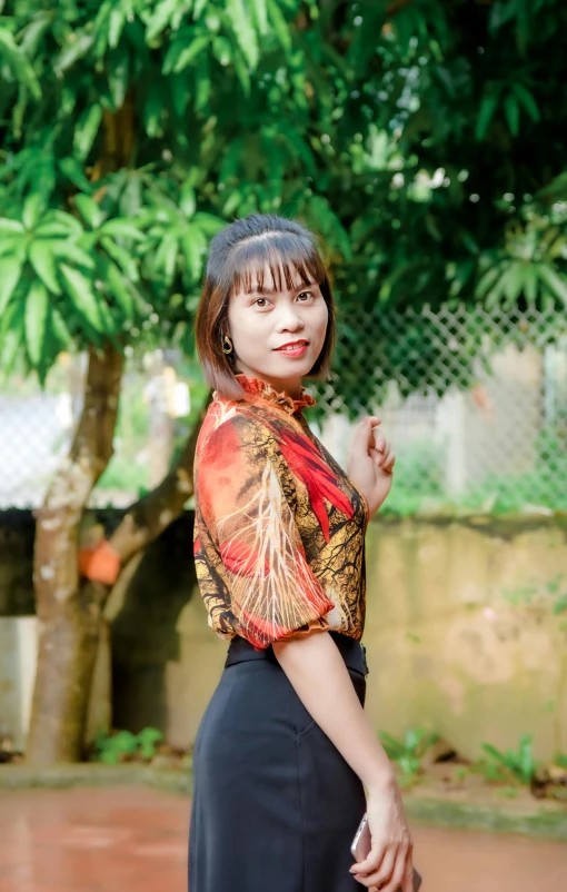 a young woman in an oriental costume in the park