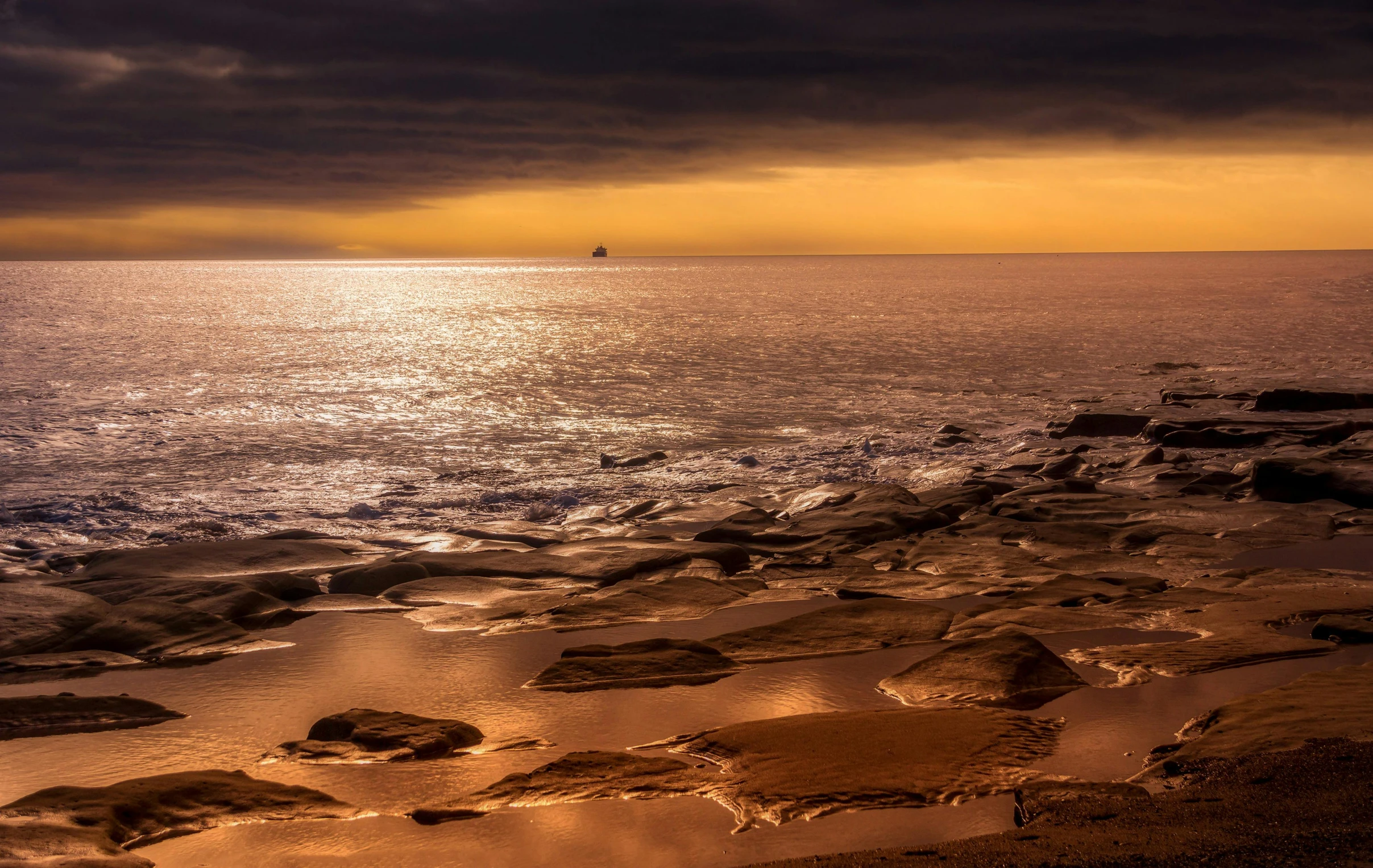 an empty rocky beach on an overcast day