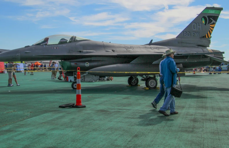 an air force jet sitting on top of a runway