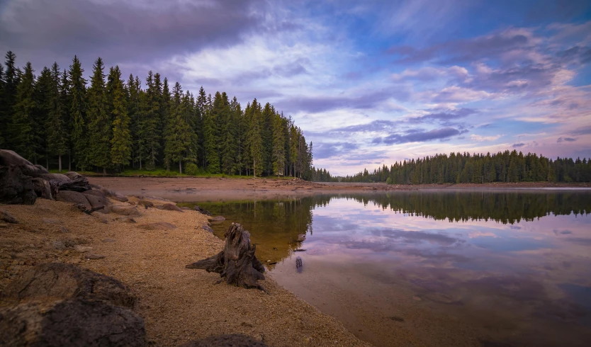 a beautiful sky is reflected on the calm water