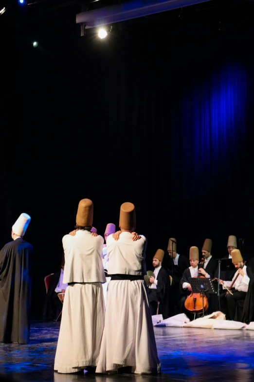 a group of people on stage performing an act