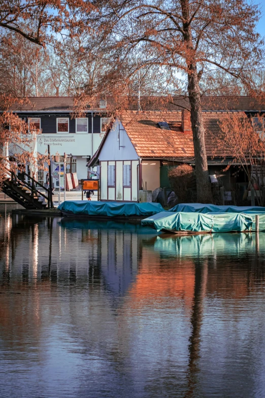 a house is shown with the roof on the water